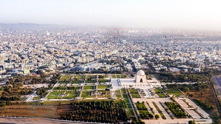 Modern Karachi with the Mausoleum Mazar-e-Quaid in the foreground.