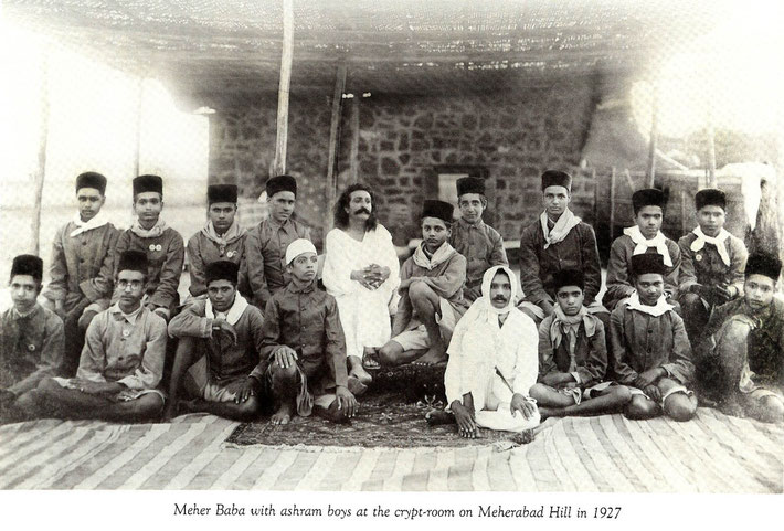 LM ; p 955 - Ali sitting in front of Baba wearing a white cap