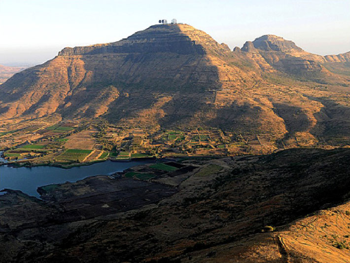 Bhorgad Mountain with radar towers on top.