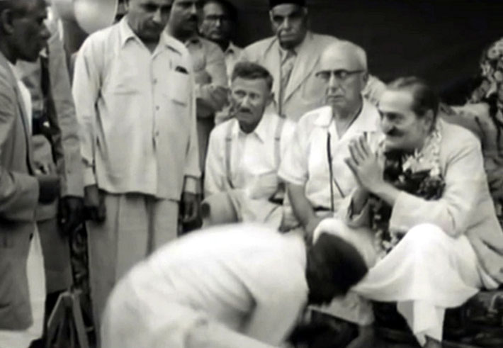 Frank is seated on the 2nd left of Meher Baba with braces.