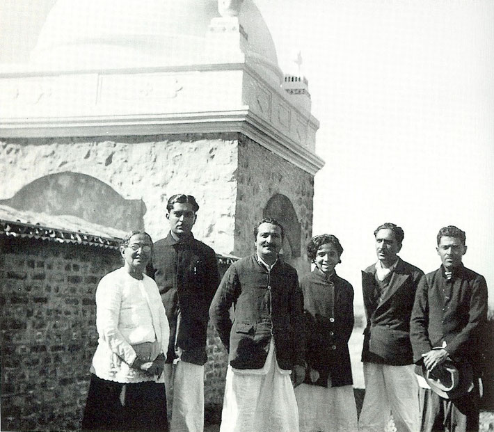 Meher Baba & his family standing near his Tomb at Upper Meherabad, India. Photo courtesy of Lord Meher - 1st Edition  page 2316