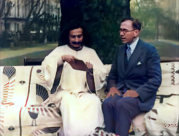 19. Mid-September 1931 : Meher Baba sitting in the common garden at the Davey's house in Kensington, London with Charles Purdom giving an interview for Paramount Films newsreel.