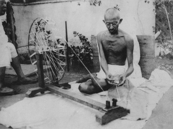 India : Gandhi spinning cotton 