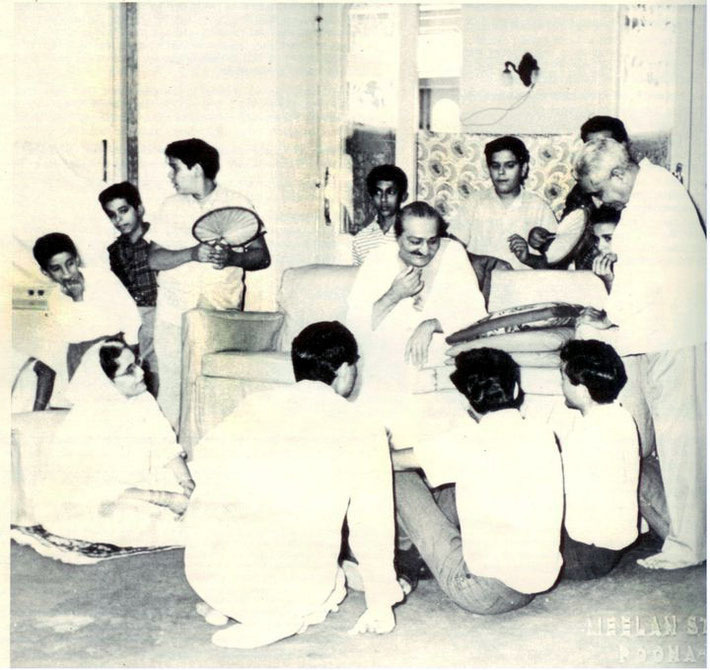 Guruprasad, Poona, India : Meher Baba gesturing to the Luck Brothers with Adi K Irani standing on far right.