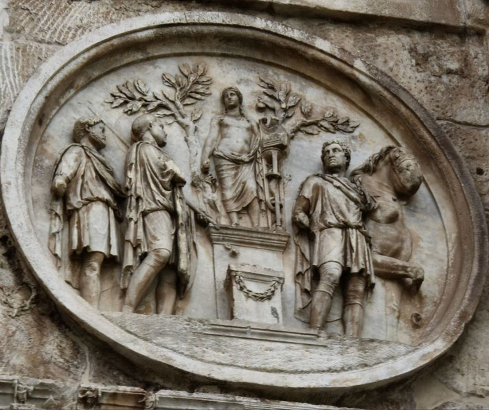 Ancient Roman relief in a roundel showing four male figures in togas, a central female figure on a pedestal, and a horse, set among trees in a ceremonial scene.