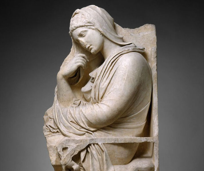 Ancient marble relief of a seated woman in draped clothing, resting her head on her hand in a thoughtful pose.