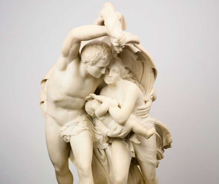 A man shielding a woman and child as they flee, symbolizing desperation and protection.