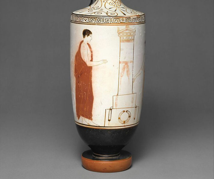 Ancient Greek white-ground lekythos showing a robed figure offering at a tomb, with fine red-figure detail and funerary theme.