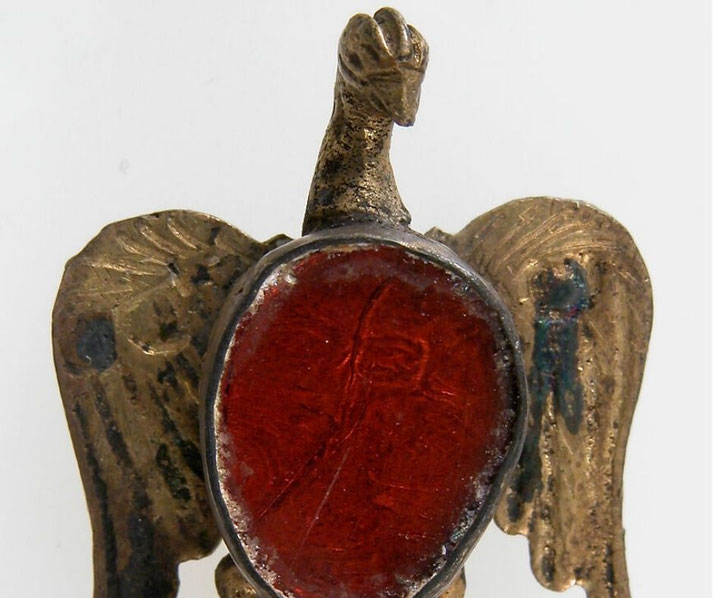 A gold eagle-shaped jewel with red glass paste, attributed to Ostrogothic metalworkers. It suits sections on Gothic art, jewellery and cultural identity.