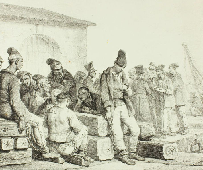 Chained prisoners in worn clothing, sitting on wooden logs, while others stand nearby. Some appear resigned, while others converse. A building and ship masts are in the background.