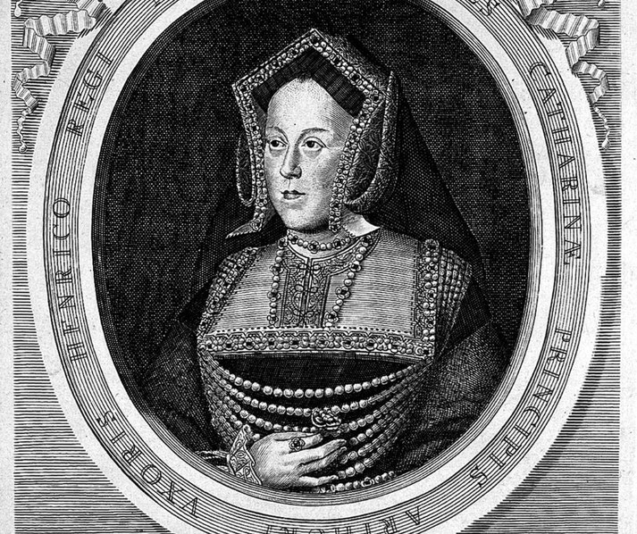 An engraved portrait of Catherine of Aragon, first wife of Henry VIII. She wears an ornate gown with pearls and a traditional English hood.