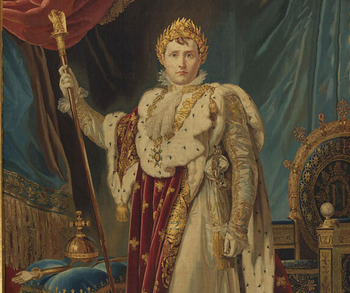 A regal figure stands in elaborate robes holding a scepter and wearing a golden laurel crown, surrounded by royal symbols and rich fabrics.