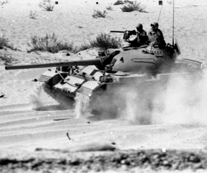 Israeli soldiers in a Soviet-made tank repurposed for IDF use.