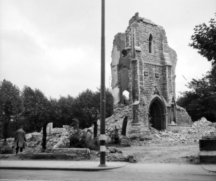 The ruined structure of a church in a London suburb shows extensive bomb damage from World War II.