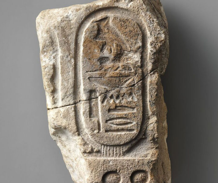 Limestone block from Egypt bearing a cartouche naming Alexander, possibly the Great or his son, with partial royal symbols.