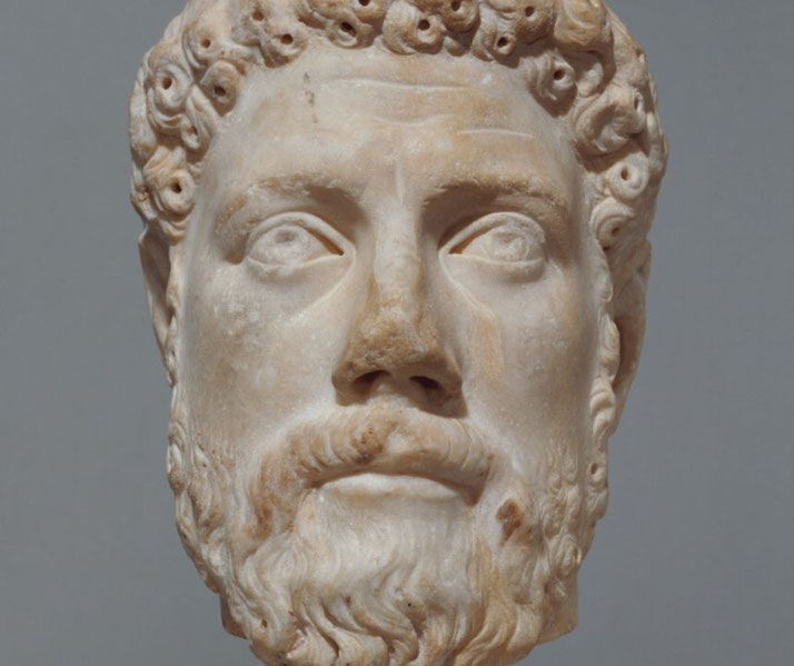 Engraved portrait of a bearded man, possibly Periander, depicted in profile with classical attire and laurel wreath.
