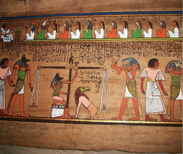 A detailed scene from the Egyptian Book of the Dead shows the Weighing of the Heart ceremony, with Anubis, Thoth, and Ammut, as the deceased's soul is judged against Ma'at's feather of truth.