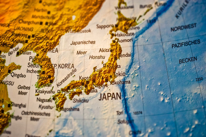 Close-up of a detailed map showing Japan, Korea, and surrounding regions with city names in German and elevation shading for geographic features.
