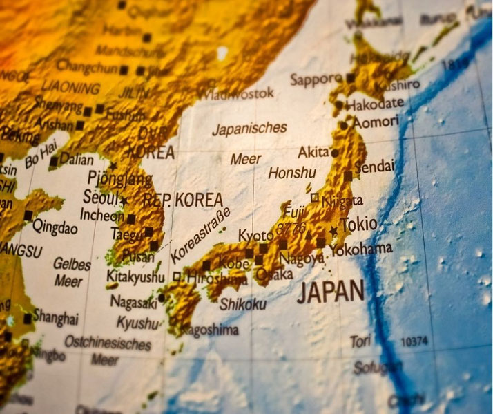 Close-up of a detailed map showing Japan, Korea, and surrounding regions with city names in German and elevation shading for geographic features.