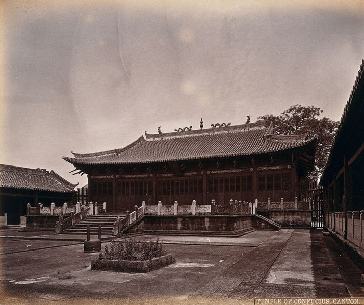 A sepia-toned photograph of the Temple of Confucius in Canton (Guangzhou). The structure features a traditional Chinese roof with ornate decorations, a raised platform, and a courtyard.