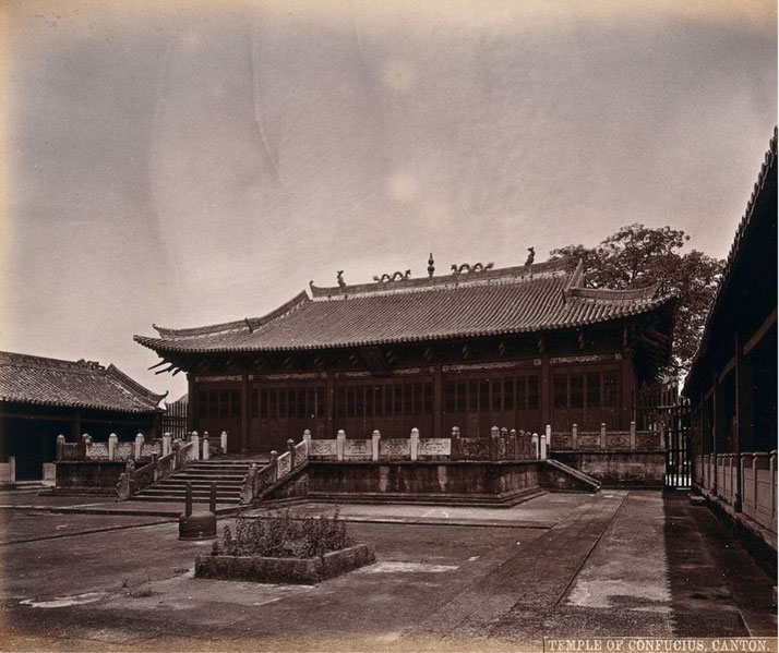 A sepia-toned photograph of the Temple of Confucius in Canton (Guangzhou). The structure features a traditional Chinese roof with ornate decorations, a raised platform, and a courtyard.