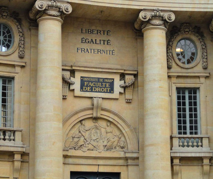The façade of the Université de Paris Faculty of Law, with neoclassical columns, a sculpted relief, and the motto "Liberté, Égalité, Fraternité" inscribed above the entrance.