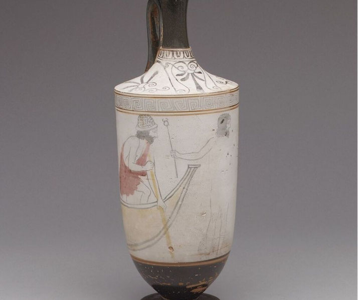 Black-figure lekythos showing Hermes with winged boots and staff guiding a youth toward Charon’s boat. Charon, dressed as a laborer in an exomis and cap, waits to ferry the deceased across.