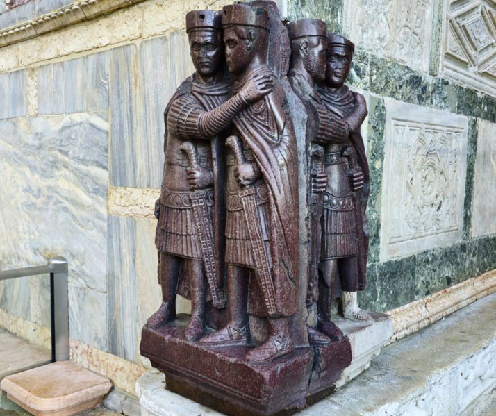 The Tetrarchs, a porphyry sculpture of four Roman rulers embracing. The statue, symbolizing unity, is embedded in the corner of St. Mark's Basilica in Venice, Italy.