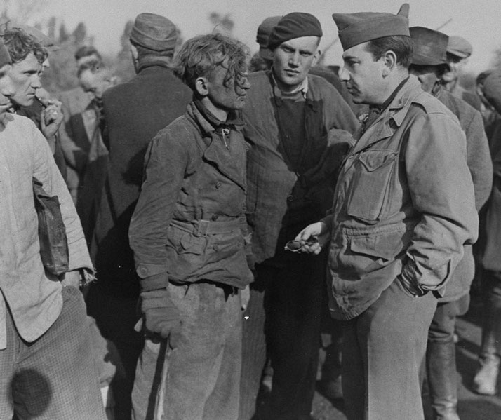 George Atlas questions a member of the Hitler Youth arrested for blowing up a U.S. Ninth Army jeep.