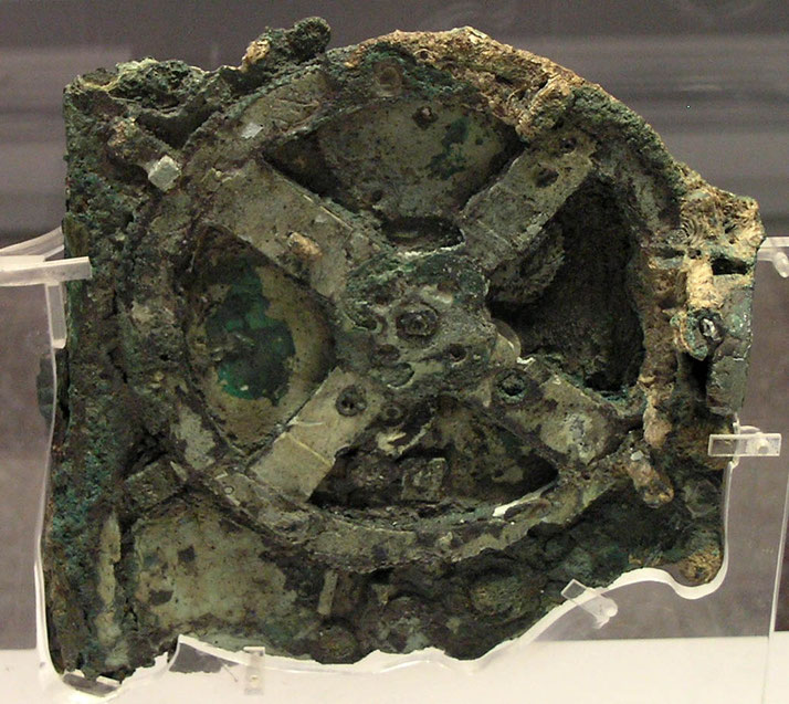The Antikythera Mechanism, a corroded ancient Greek device with visible gears.