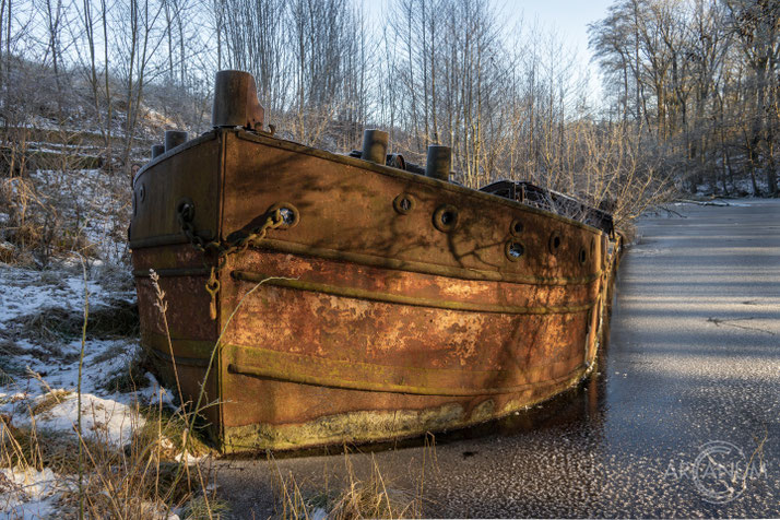 This rusty old barge is the only remaining remnant of a large former brick port