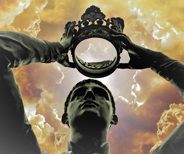 A dramatic image of a statue holding up a hollow crown against a cloudy, golden sky.