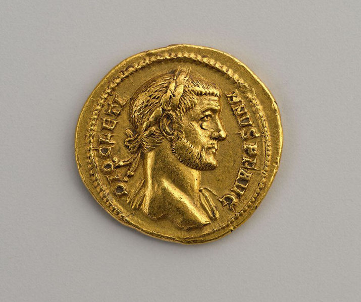 A gold aureus of Emperor Diocletian. The coin features a detailed profile of Diocletian wearing a laurel wreath, with inscriptions along the edge.
