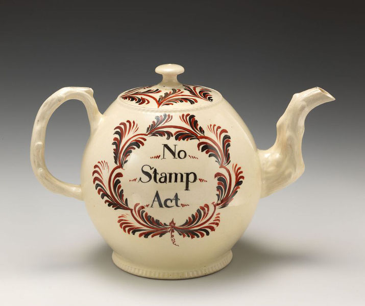 An 18th-century teapot with "No Stamp Act" inscribed, symbolizing colonial American protest against British taxation. Such items were used to express resistance to the 1765 Stamp Act.