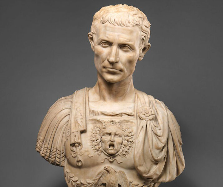 Julius Caesar in detailed military attire, featuring a sculpted cuirass with mythological imagery.
