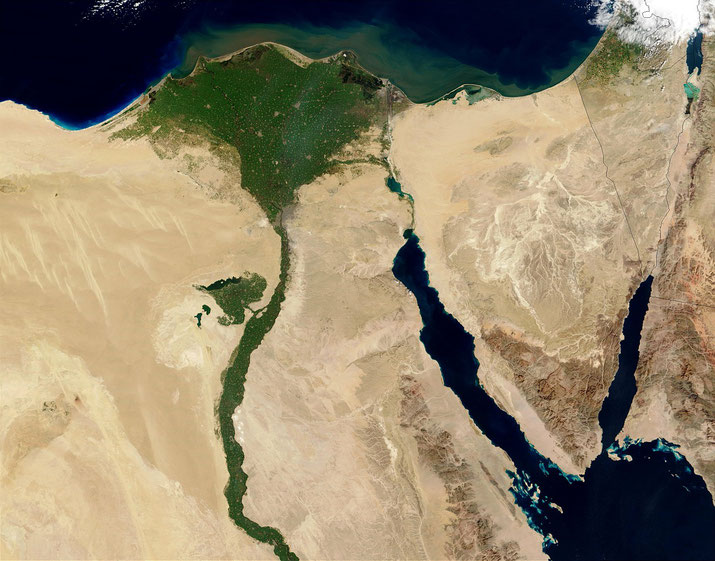 Satellite view of Egypt showing the Nile River flowing north through the desert to the Mediterranean Sea.