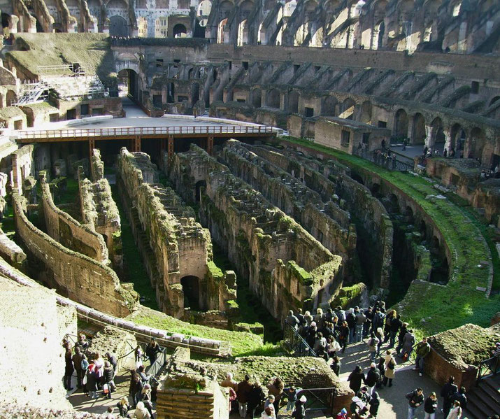 The interior of the Colosseum in Rome, revealing the exposed hypogeum, an underground network of tunnels and chambers.