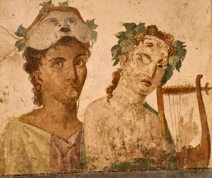 Ancient fresco of two figures; one wears a theatrical mask on their head, the other plays a lyre, both adorned with vine leaves, possibly depicting muses or performers.