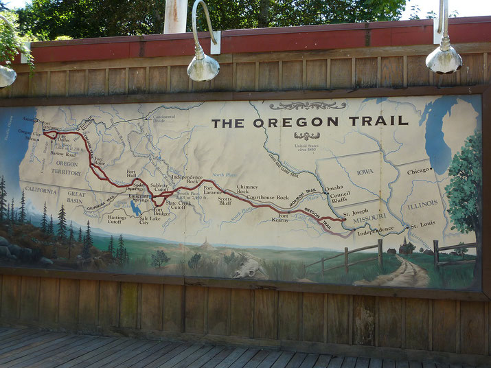 Illustrated map of the Oregon Trail showing pioneer routes across the U.S. with labeled landmarks and trails from Missouri to Oregon.