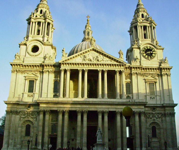 St. Paul’s Cathedral in London stands tall with its dome and twin clock towers bathed in morning light.