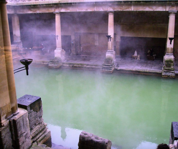 The steaming waters of the Roman Baths in Bath, England.
