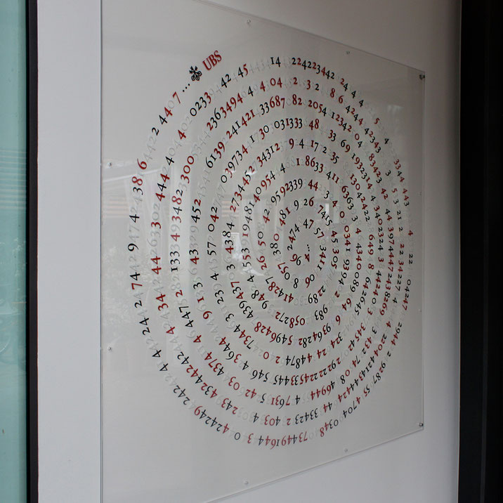 Spiral wall installation with printed numerical layers on plexiglass by Paolo Grassi at the entrance of UBS SA, Ascona