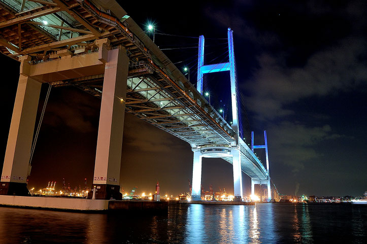 Lighting up Bay Bridge in the dark. There exists nighttime regularaions in the harbor.