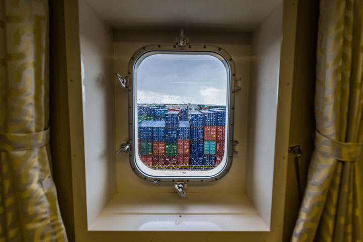 Container ship window looking to the containers