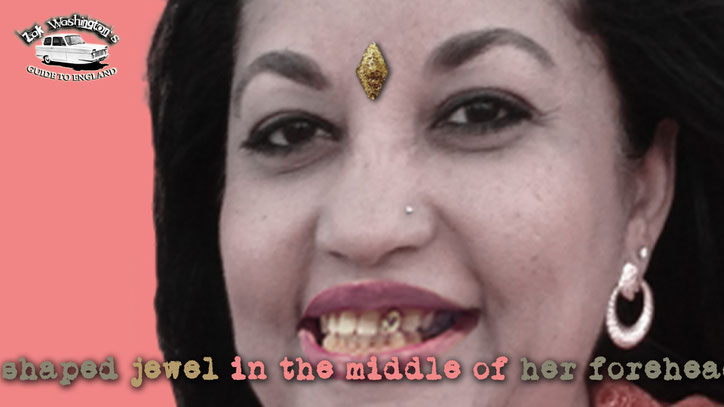 Indian woman with a jewel on her forehead and a gold tooth. From ZakWashington