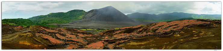 Volcano Yasur on Tanna Island in Vanuatu behind red lava fields