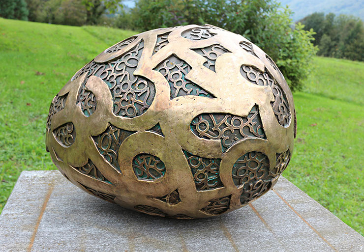 big egg sculpture bronze outdoor installation paolo grassi landscape