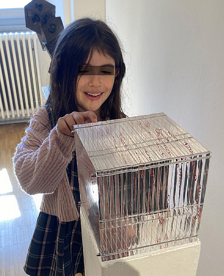 Young girl with Paolo Grassi artwork, Younique Lugano.