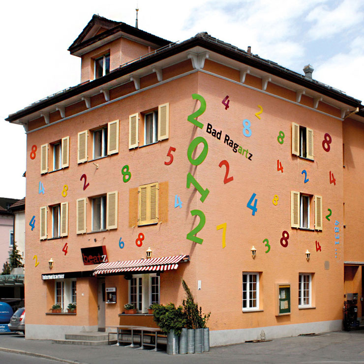 Installation view of Paolo Grassi's monumental numeric artwork for Bad Ragartz 2012 on the building façade, Switzerland.