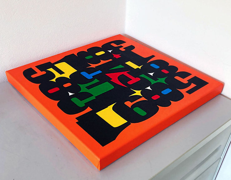 Pop Icons Orange by Paolo Grassi – Abstract painting with black numbers on orange canvas, photographed in perspective on white cabinet